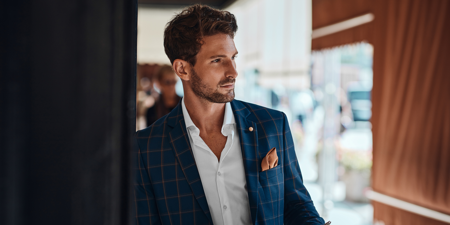 HANDSOME WELL-GROOMED MAN WITH A BEARD 